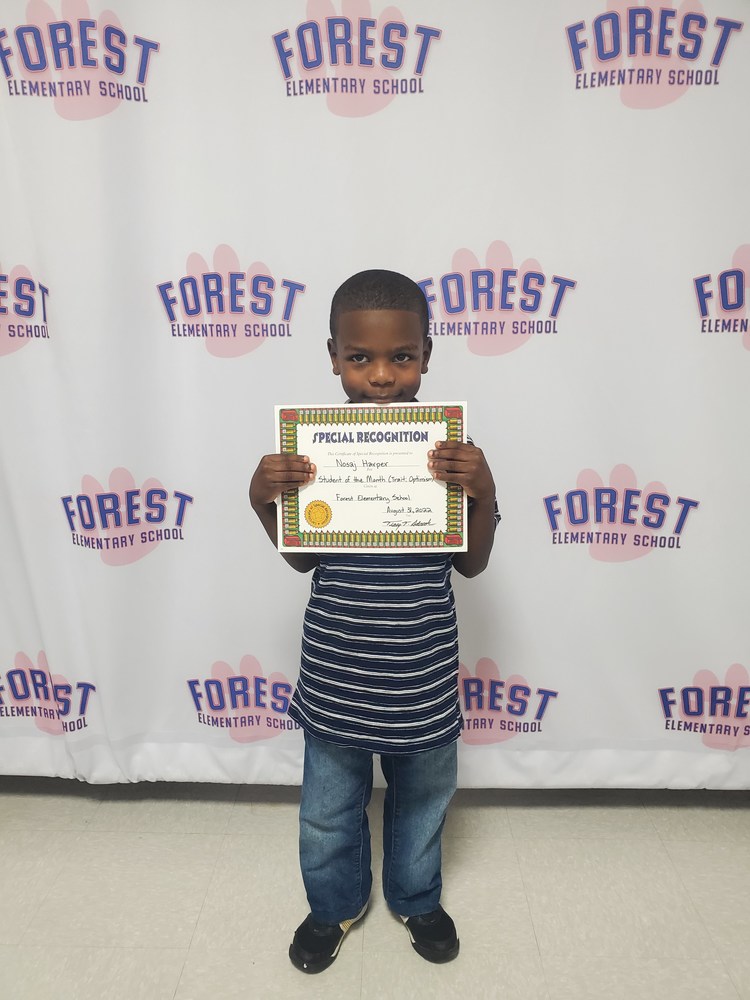 Picture of first grade student of the month.